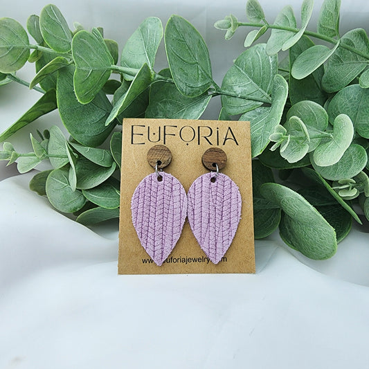 Leather teardrop earrings with round wood post. Lilac purple, woven palm leaf texture.