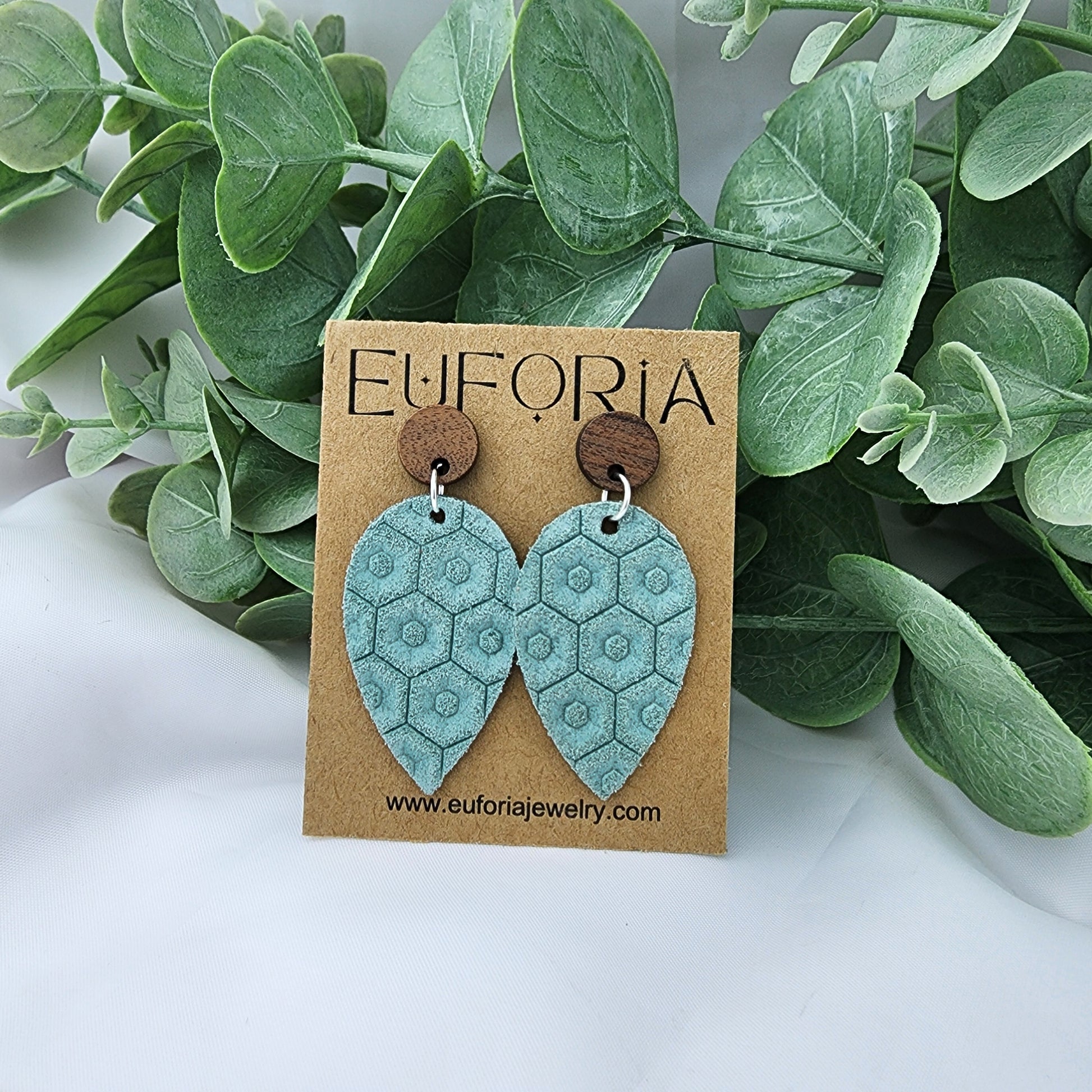 Leather teardrop earrings with round wood post.  Seafoam green with beehive texture.